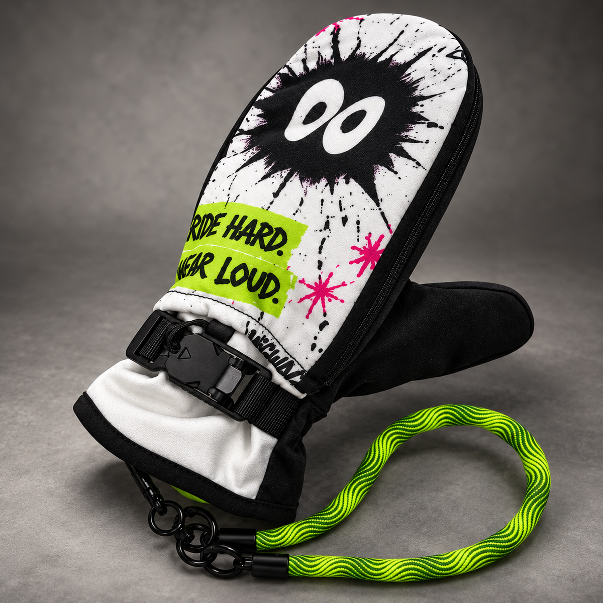 WIGWAG white Ride Hard Wear Loud mitten with lime leash, polished in a grey studio photography style.
